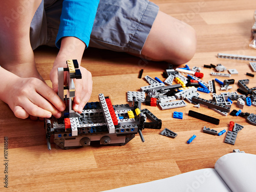 Child collects plastic building kit photo