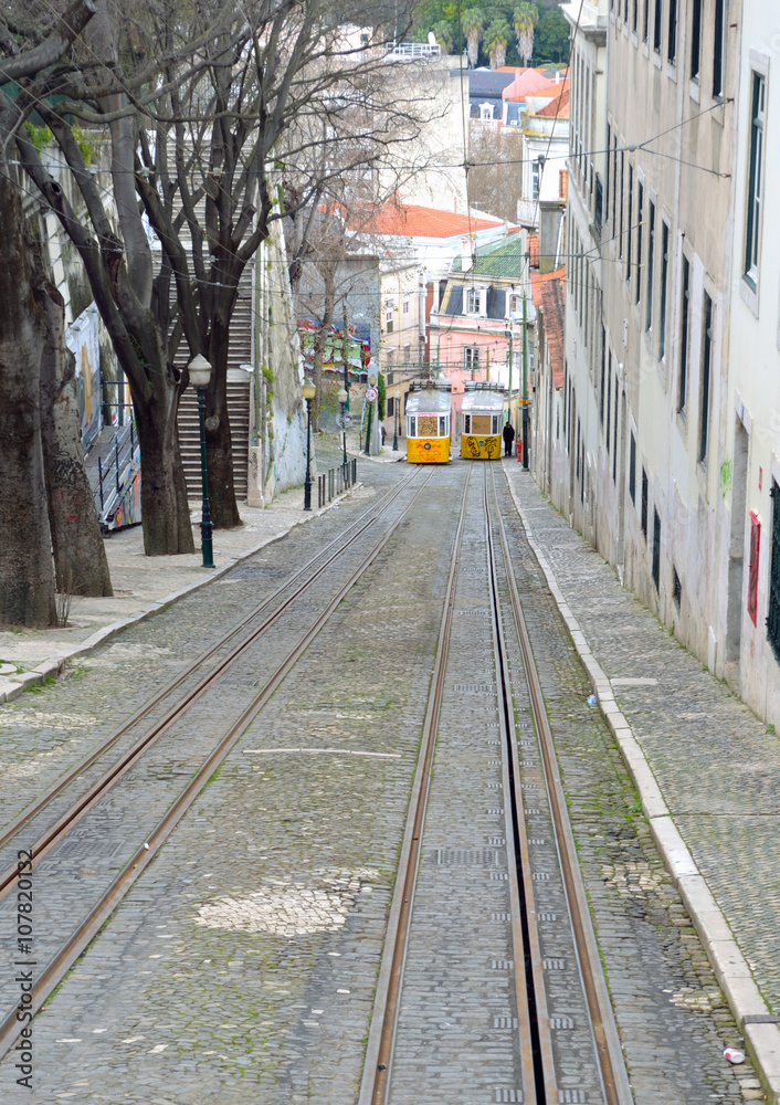 The steep slope of Elevador da Gloia vintage funicular railway Lisbon Portugal.