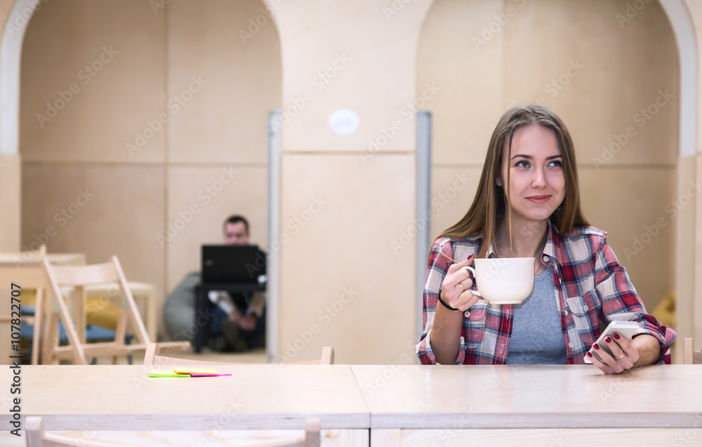 College Campus Kitchenette Area and young Lady drinking Tea College Campus Kitchenette Area and young Lady drinking Tea
