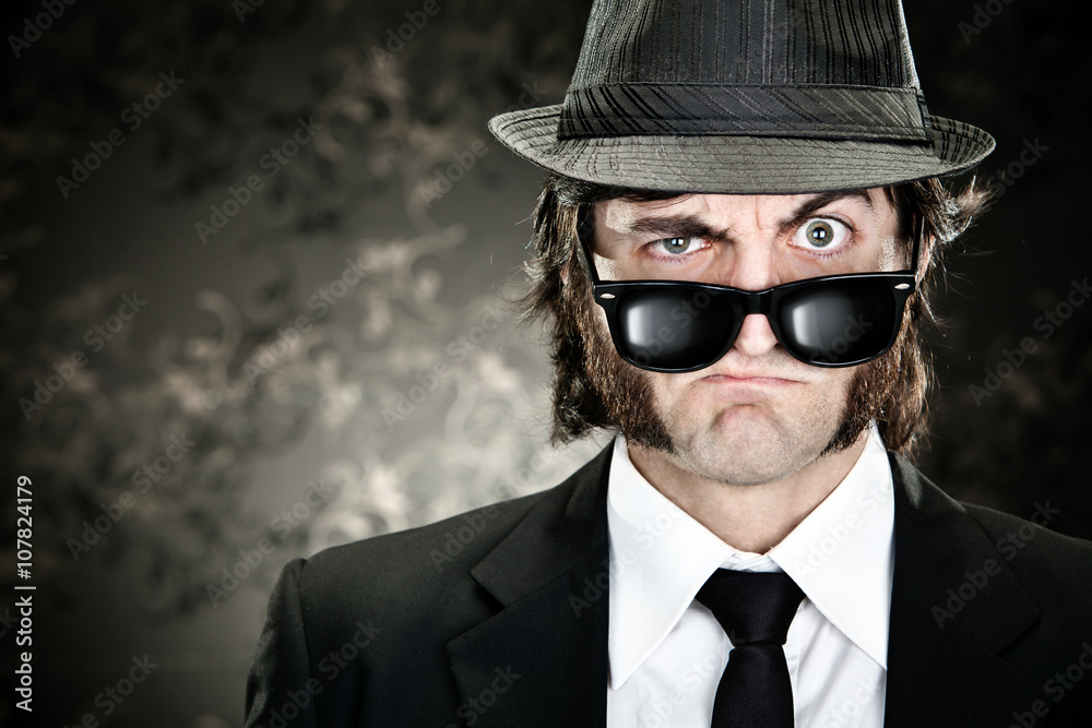 elegant boss man with sideburns and sunglasses on black backround elegant boss man with sideburns and sunglasses on black backround