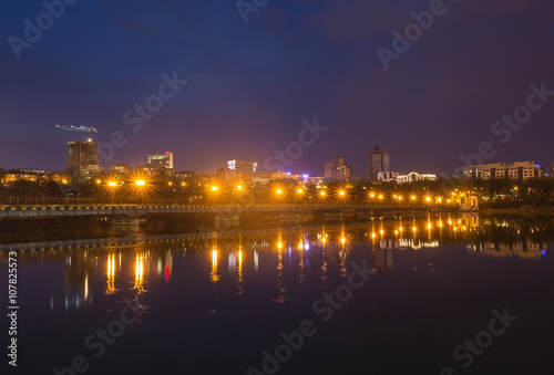 Fototapeta Naklejka Na Ścianę i Meble -  Night city reflection on the river in Donetsk. Ukraine