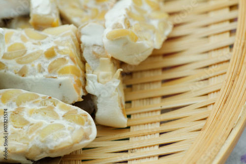 Sliced fresh raw tempeh. Close up showing texture of tempeh. Tempeh is made from soya bean and popular in some part of Asia.
