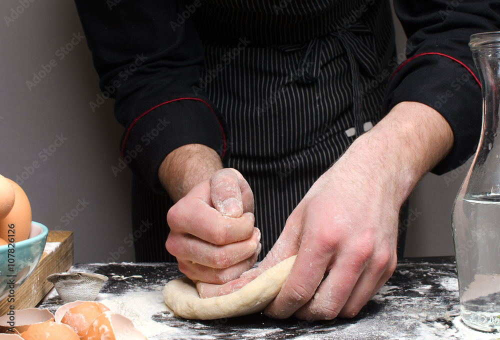 Chef prepares the dough for pasta
