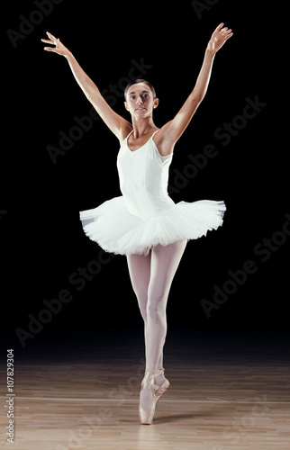 beautiful classical dancer on black background