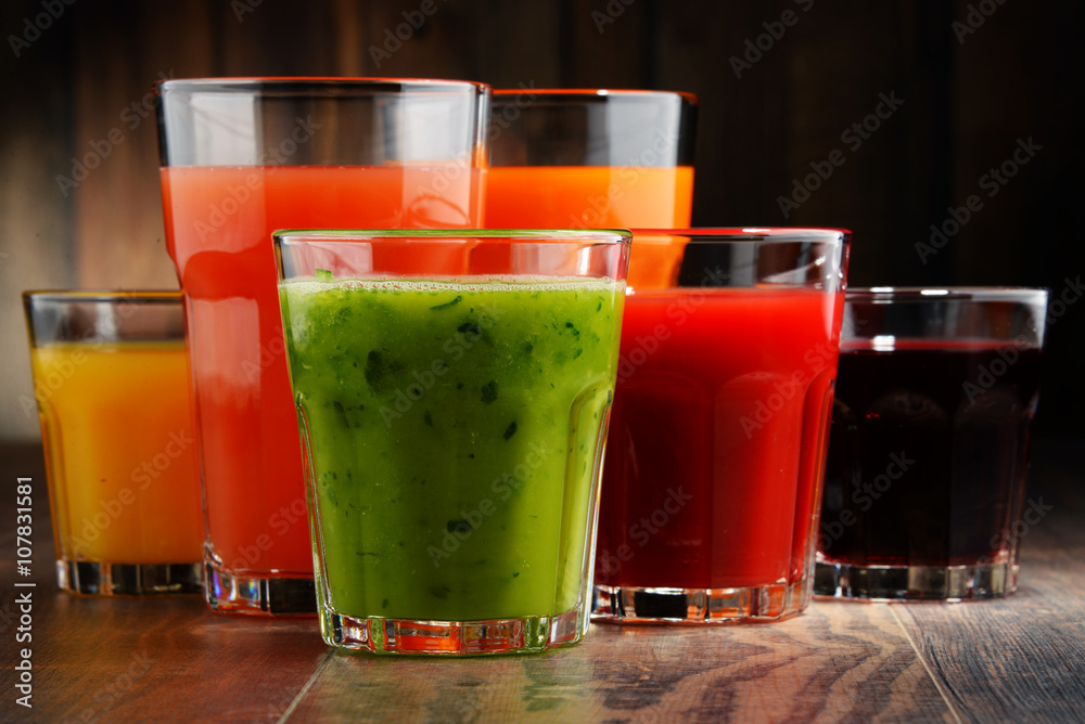 Glasses with fresh organic vegetable and fruit juices Glasses with fresh organic vegetable and fruit juices