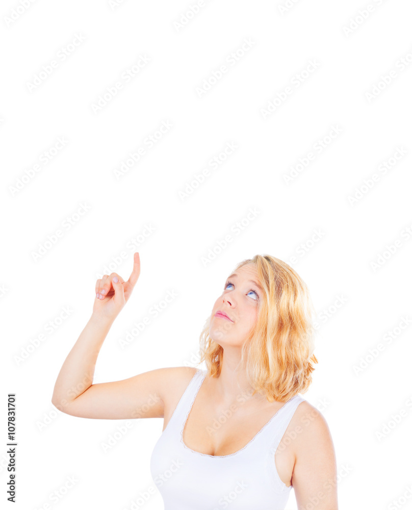 Young woman pointing up, copy space Young woman pointing up, copy space