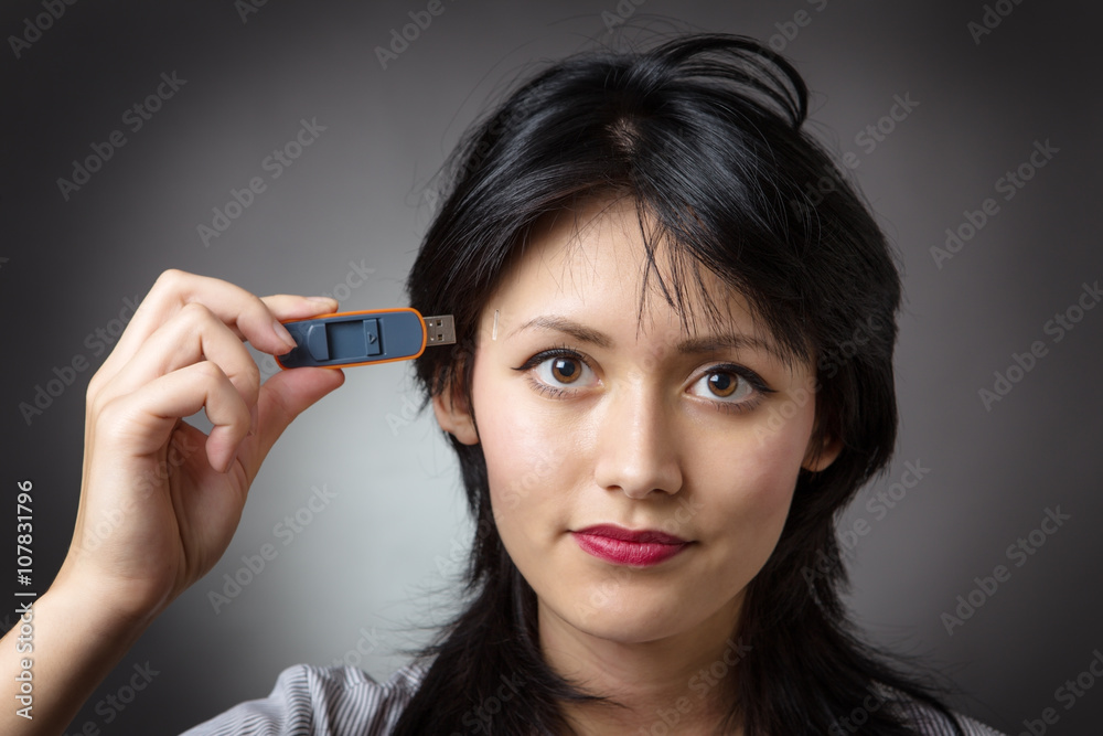 Obraz premium pluging memory stick into head