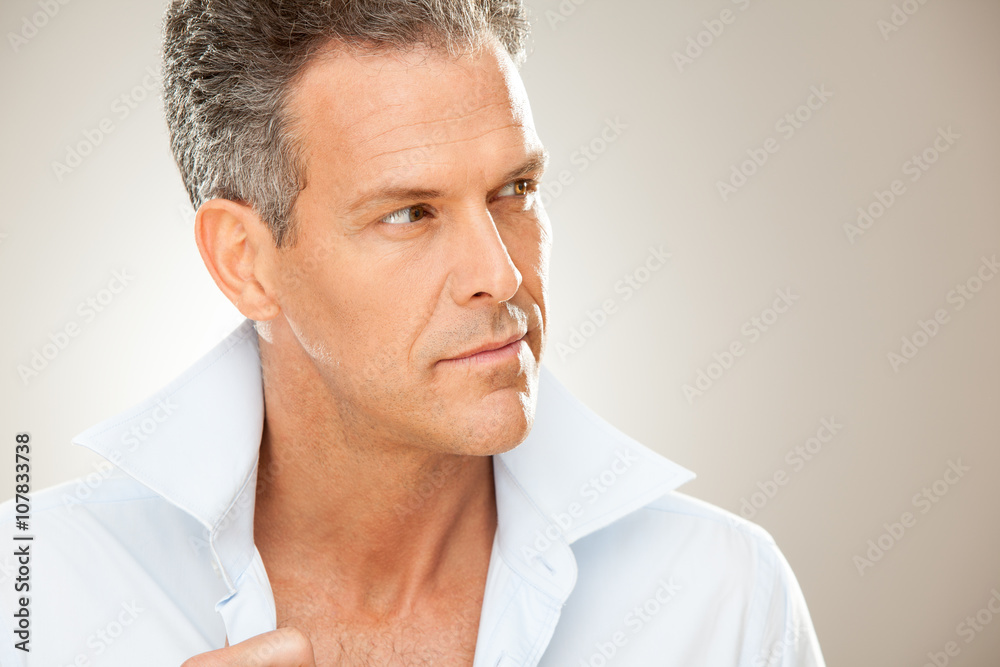 handsome man with shirt portrait isolated on grey handsome man with shirt portrait isolated on grey