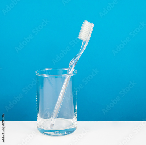 The clear toothbrush with small glass for brushing the teeth.