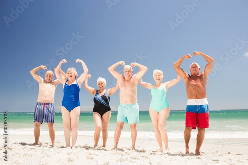 Senior friends showing their muscles