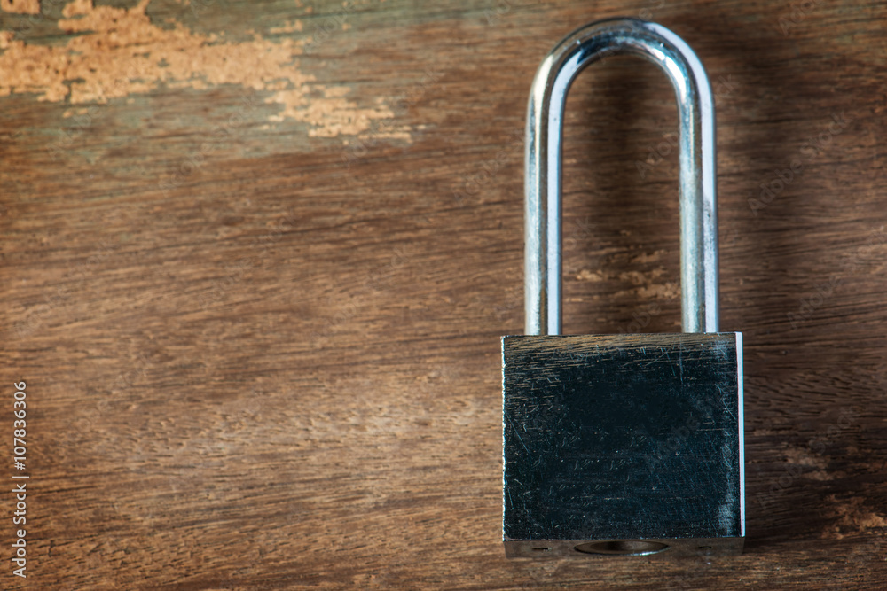 Fototapeta premium Padlock on wooden, Closed lock security