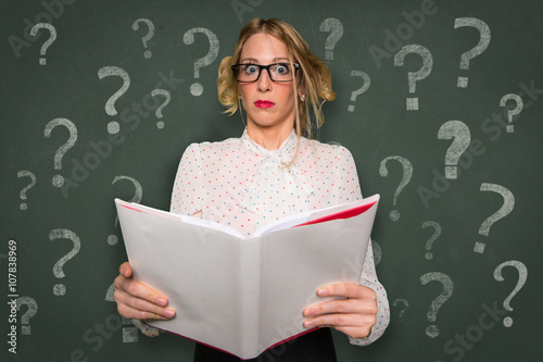 Reading a self help book with blank space assistance questions instruction advice question mark confused learning 