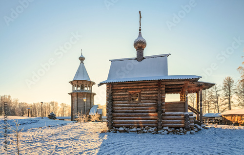 A winter view of the parish house  and the belfry of Pokrovskaya church at Bogoslovka manor in Saint-Petersburg 