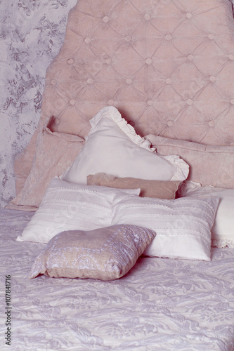 white pillows on classic bed in bedroom