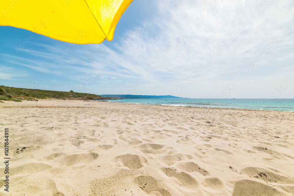 yellow parasol in Le Bombarde beach