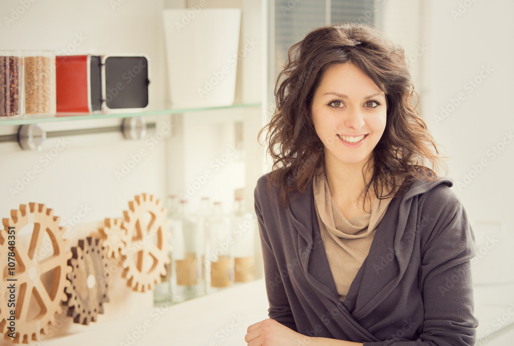 young smiling woman portrait in the kitchen young smiling woman portrait in the kitchen
