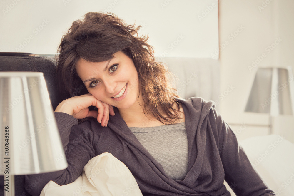 young smiling brunette girl relax in her bedroom young smiling brunette girl relax in her bedroom