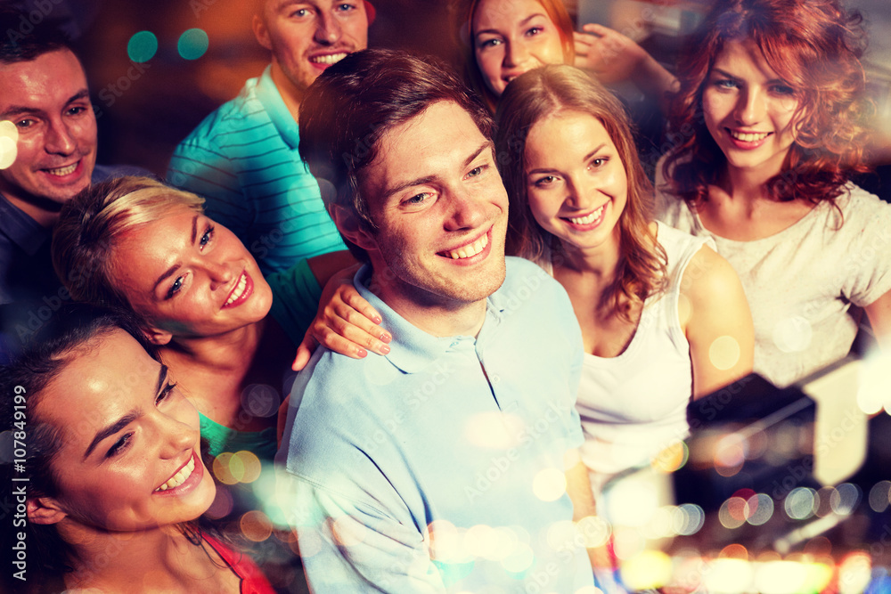 friends with smartphone taking selfie in club friends with smartphone taking selfie in club