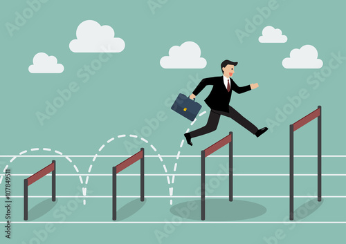Businessman jumping higher over hurdle photo
