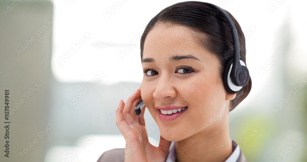 Composite image of close up of a smiling operator posing Composite image of close up of a smiling operator posing