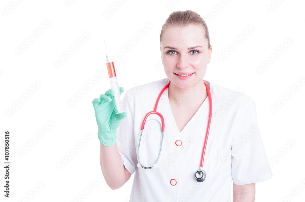 Portrait of young female doctor smiling and holding a syringe Portrait of young female doctor smiling and holding a syringe
