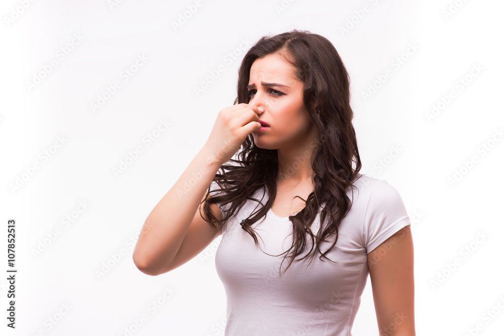 Young sick or cold woman holding a pill before eat, isolated on white Young sick or cold woman holding a pill before eat, isolated on white
