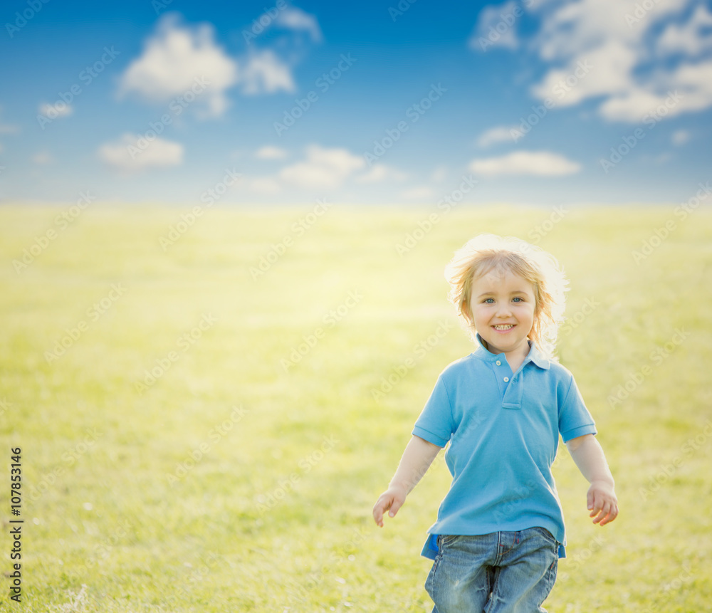 happy smiling blond child play in the park happy smiling blond child play in the park