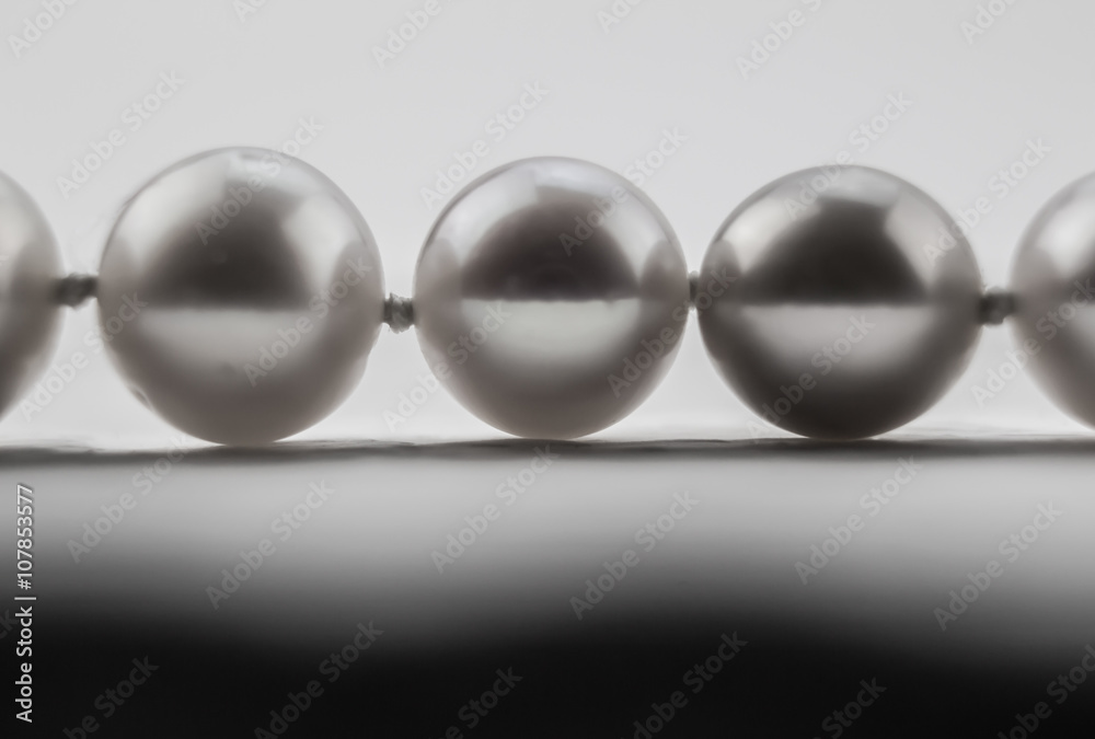 Macro photo of three pearls in a row isolated on white Macro photo of three pearls in a row isolated on white