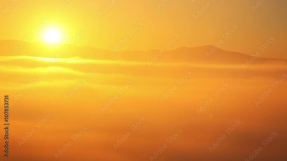 High point shooting. Thick fog showing only the tops of the mountains. The sun is bright. Not tinted. Time lapse High point shooting. Thick fog showing only the tops of the mountains. The sun is bright. Not tinted. Time lapse
