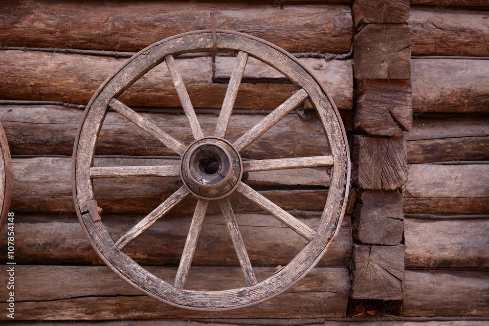 cart wagon old wheel on wooden wall