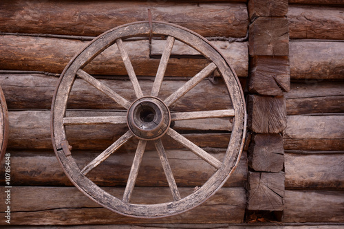cart wagon old wheel on wooden wall