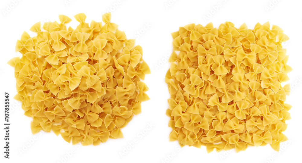Pile of dry farfalle pasta over isolated white background Pile of dry farfalle pasta over isolated white background
