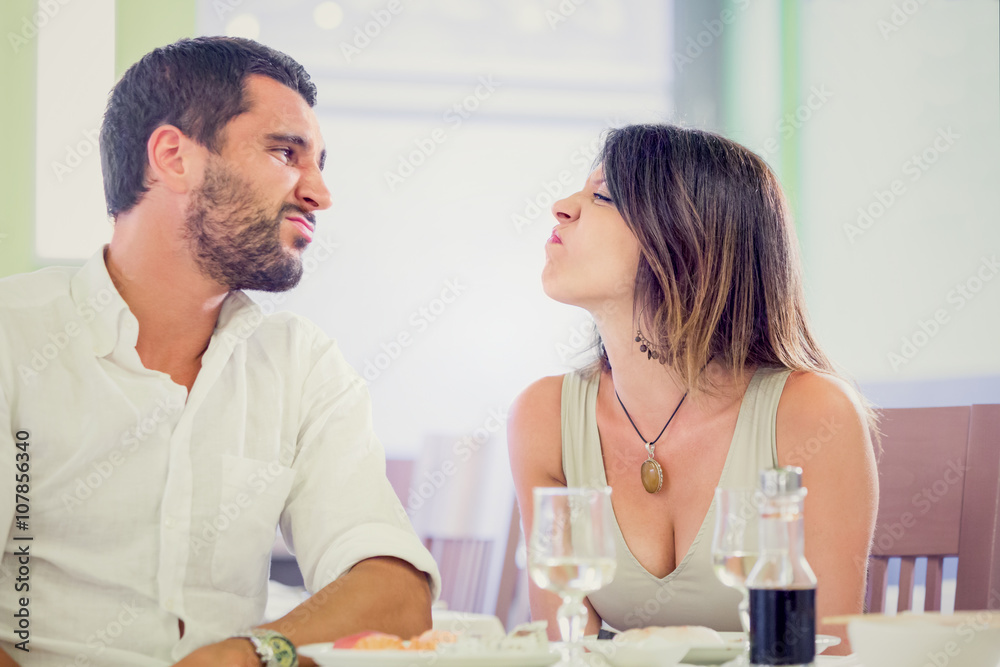 Fototapeta premium Young romantic couple have fun at restaurant
