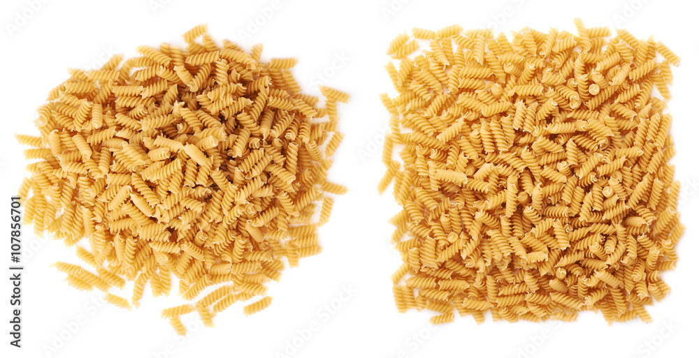 Pile of dry rotini pasta over isolated white background Pile of dry rotini pasta over isolated white background