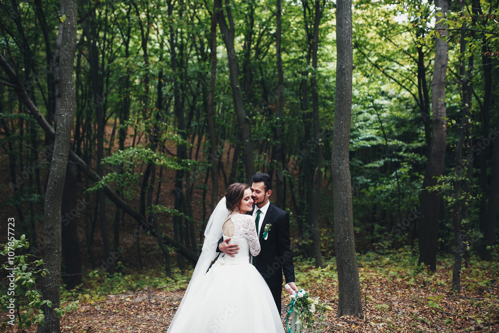 Nice couple among the green trees Nice couple among the green trees