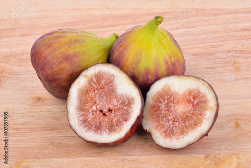 Fresh figs on wooden background