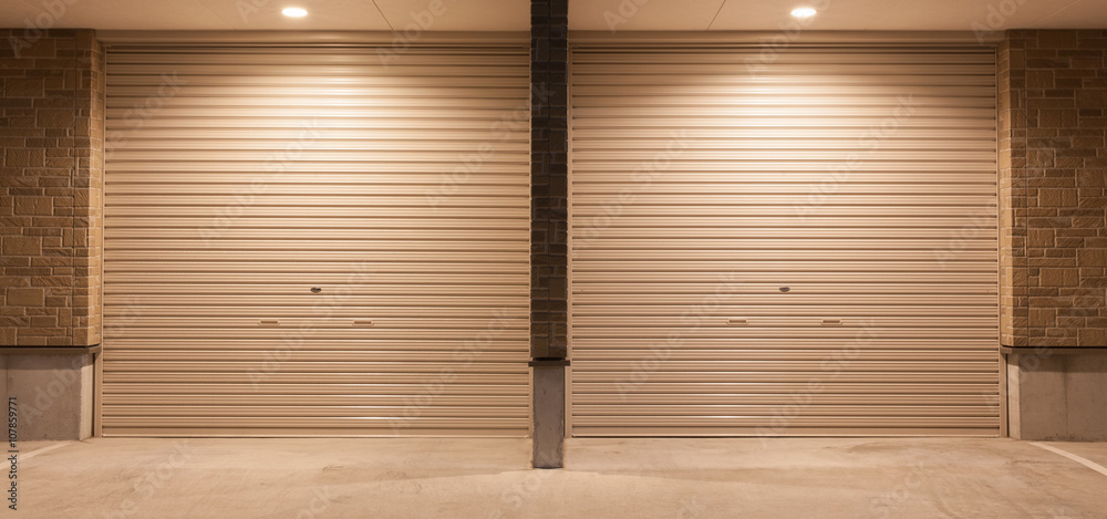 Obraz premium Metal door shutter closed at night time