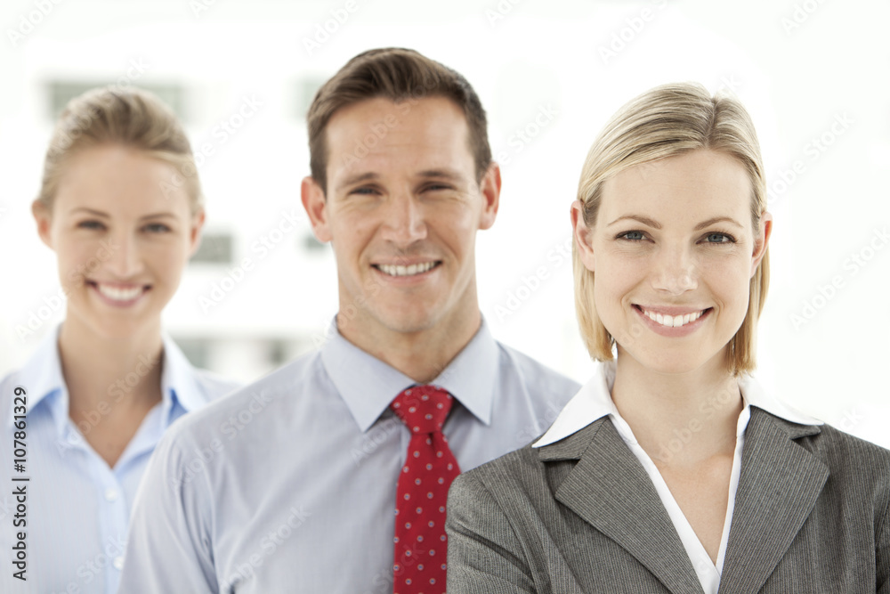 Portrait of a young business team with people standing in a row Portrait of a young business team with people standing in a row