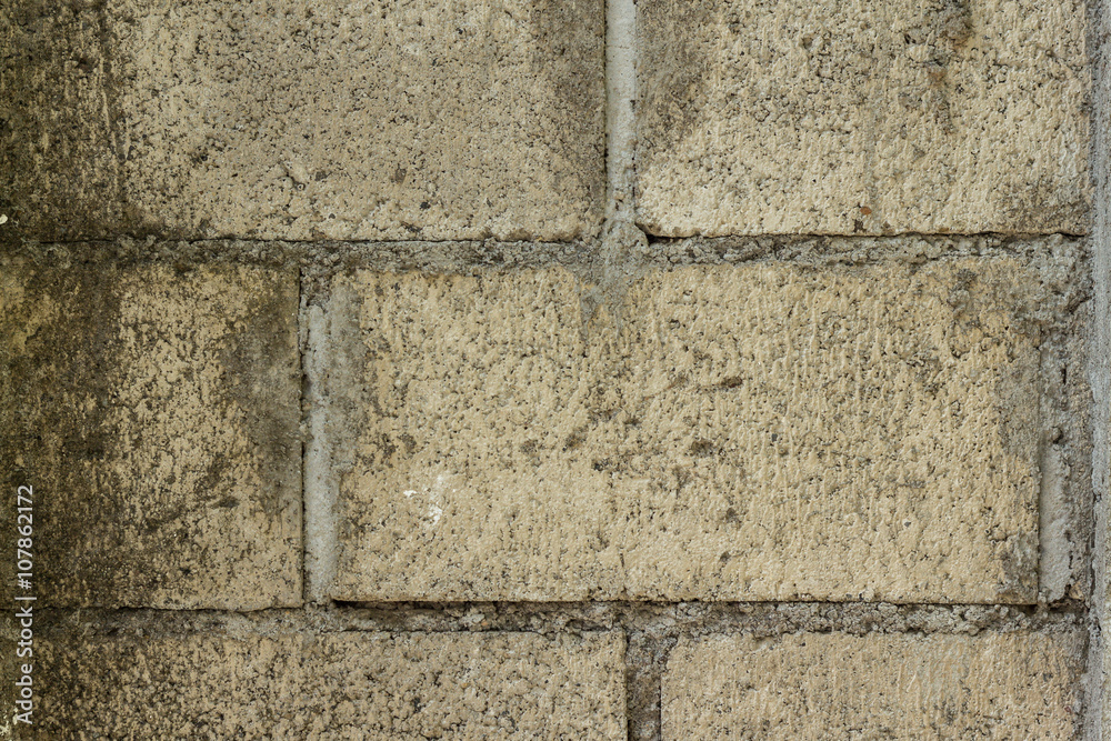 Obraz premium Steintextur einer Steinziegelmauer