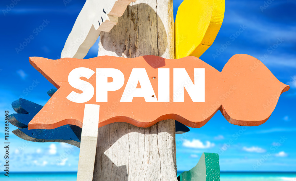 Spain signpost with beach background - obrazy, fototapety, plakaty 