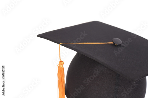 Bilde på lerret Black Graduation Hat with Gold Tassel isolated on white backgrou