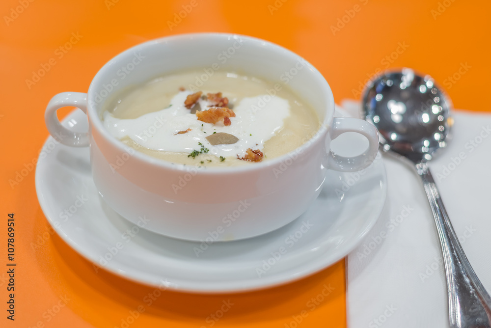 Mushroom cream soup on orange background Mushroom cream soup on orange background