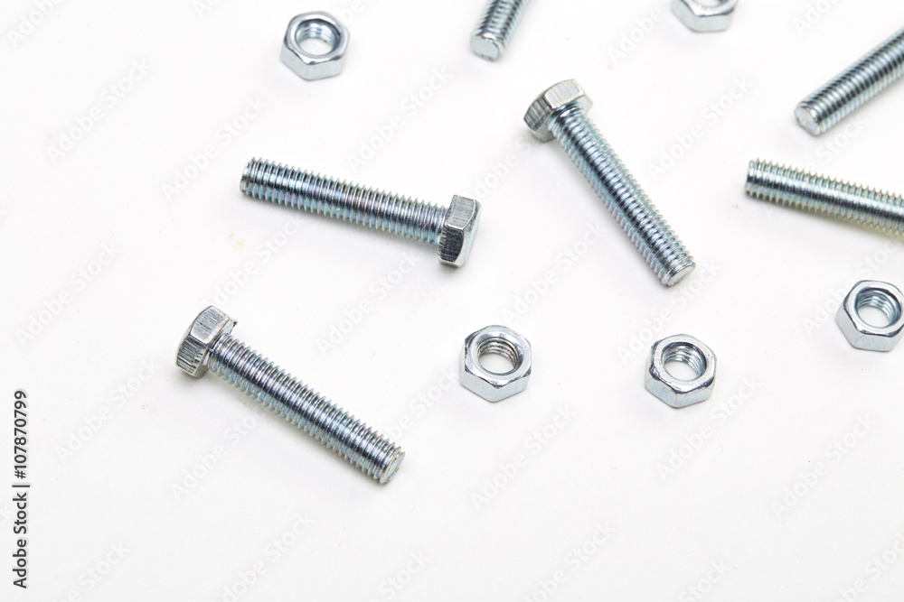 Bolts and nuts and washers on white paper
Bolts and nuts and washers on white paper