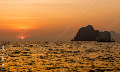 sunset into the sea yellow light