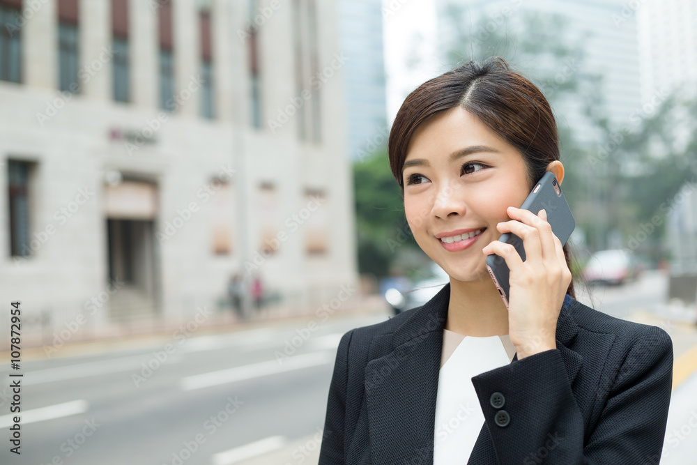 Business woman talk to mobile phone Business woman talk to mobile phone