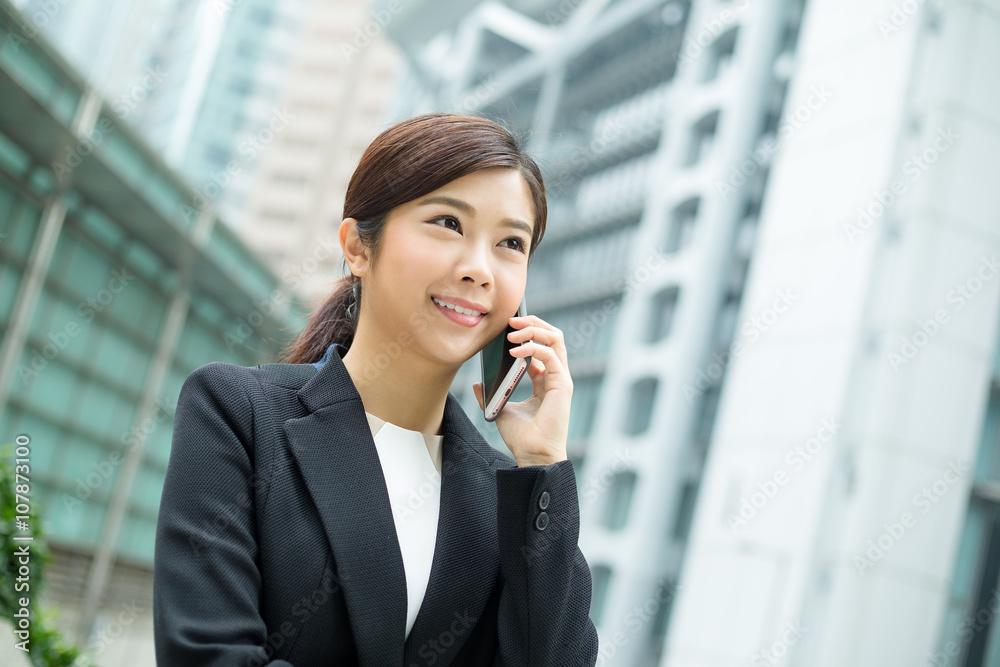 Young business woman talk to mobile phone Young business woman talk to mobile phone
