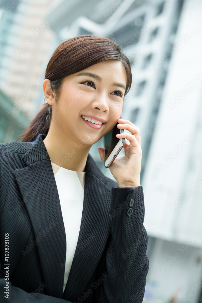 Businesswoman chat on cellphone Businesswoman chat on cellphone