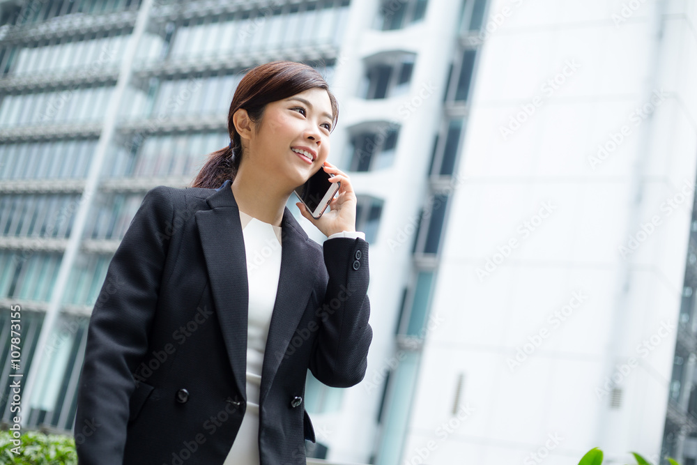 Businesswoman talk to mobile phone Businesswoman talk to mobile phone