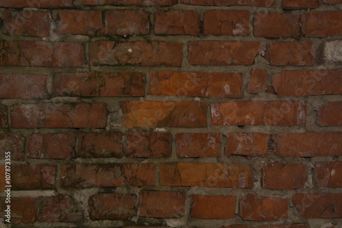 Dark red brick wall background texture horizontal stained grungy