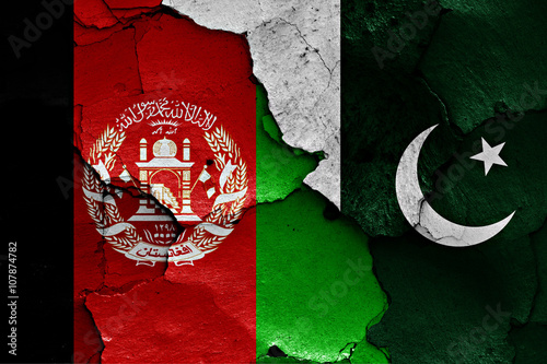 flags of Afghanistan and Pakistan painted on cracked wall